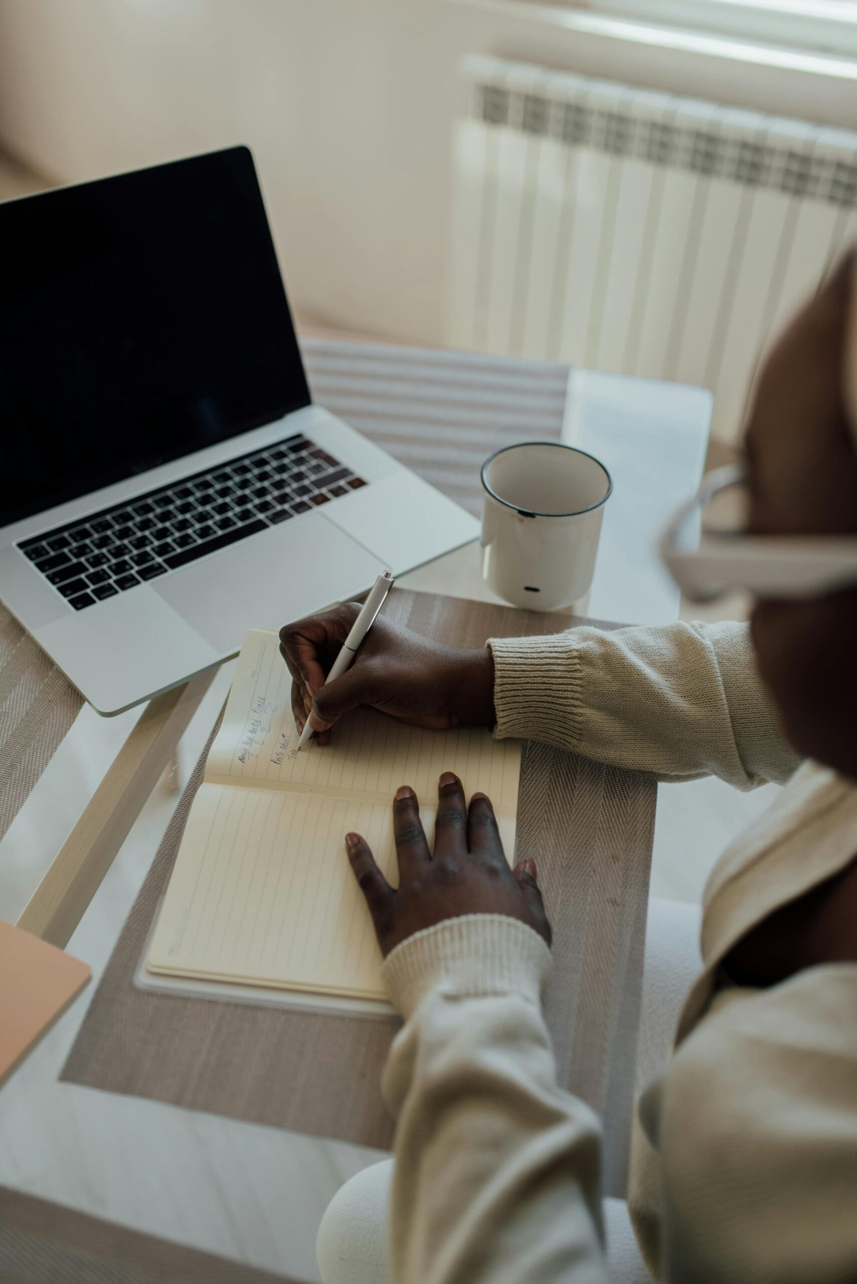 woman working at desk writing a blog post