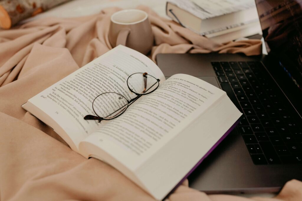 Learn how to create a successful blog to build a cozy business you can run from your bed with a book coffee and laptop.