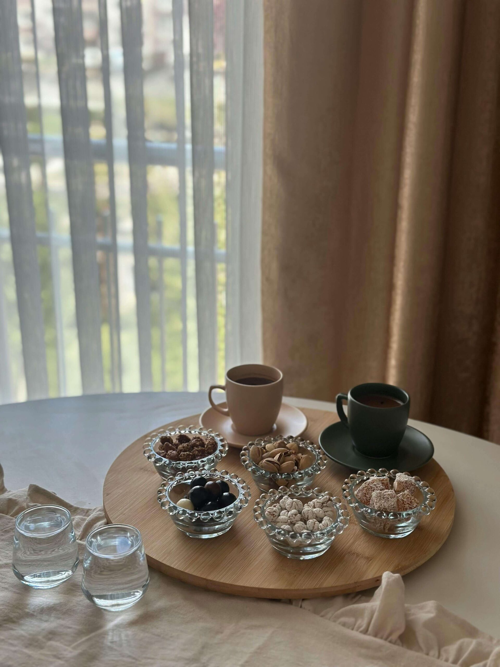 Snacks and coffee on a table for a cozy ambiance to protect your energy as a projector in human design