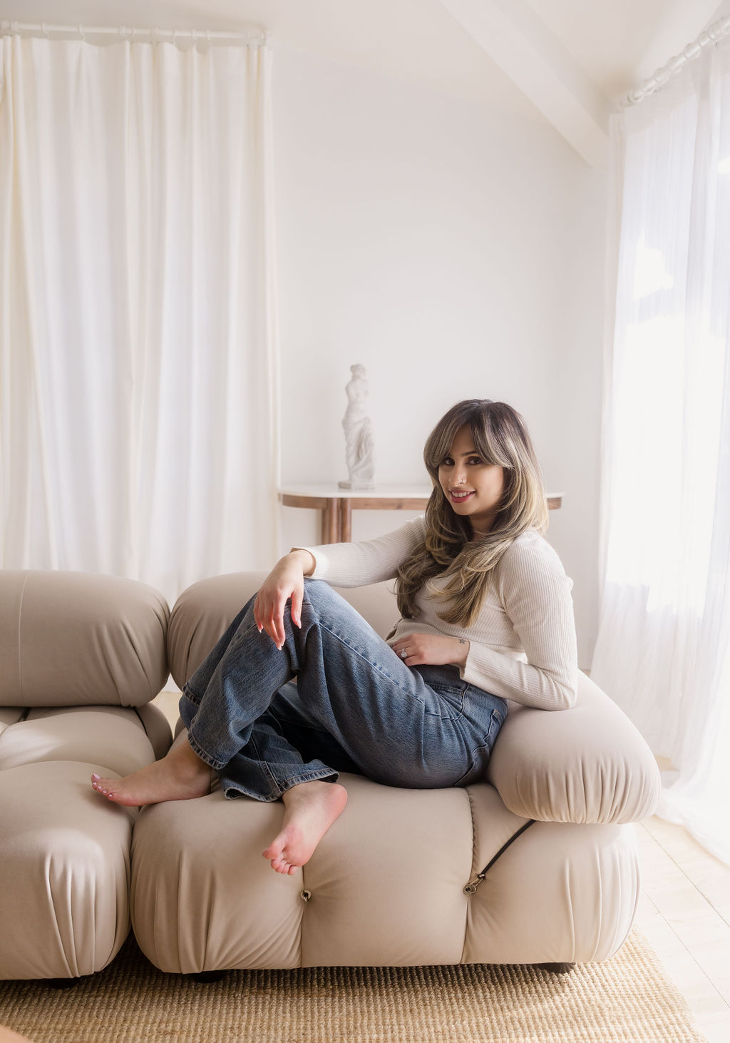 Website designer and blog strategist sitting on a couch