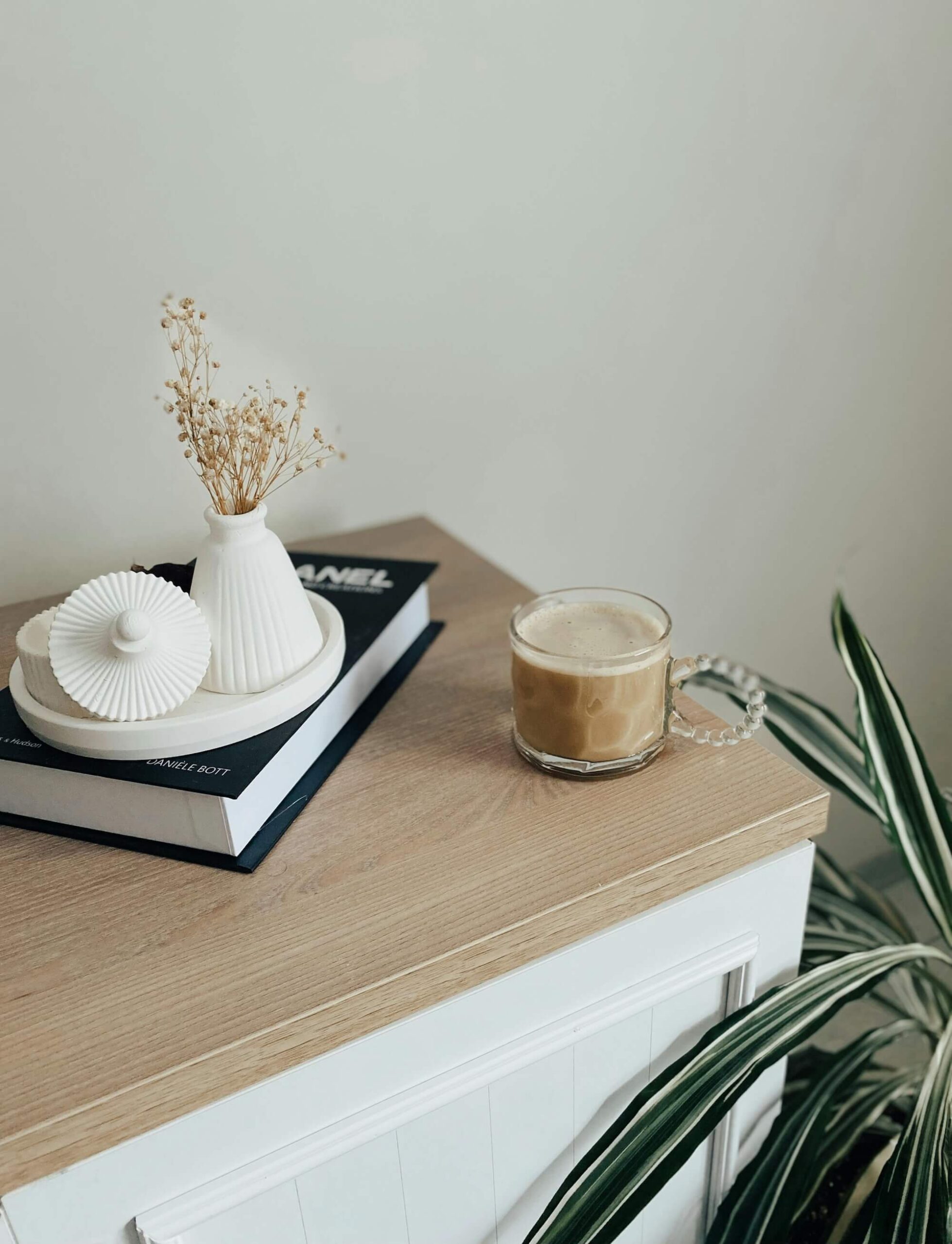 cozy set up with coffee and accessories on a desktop perfect for being an introvert