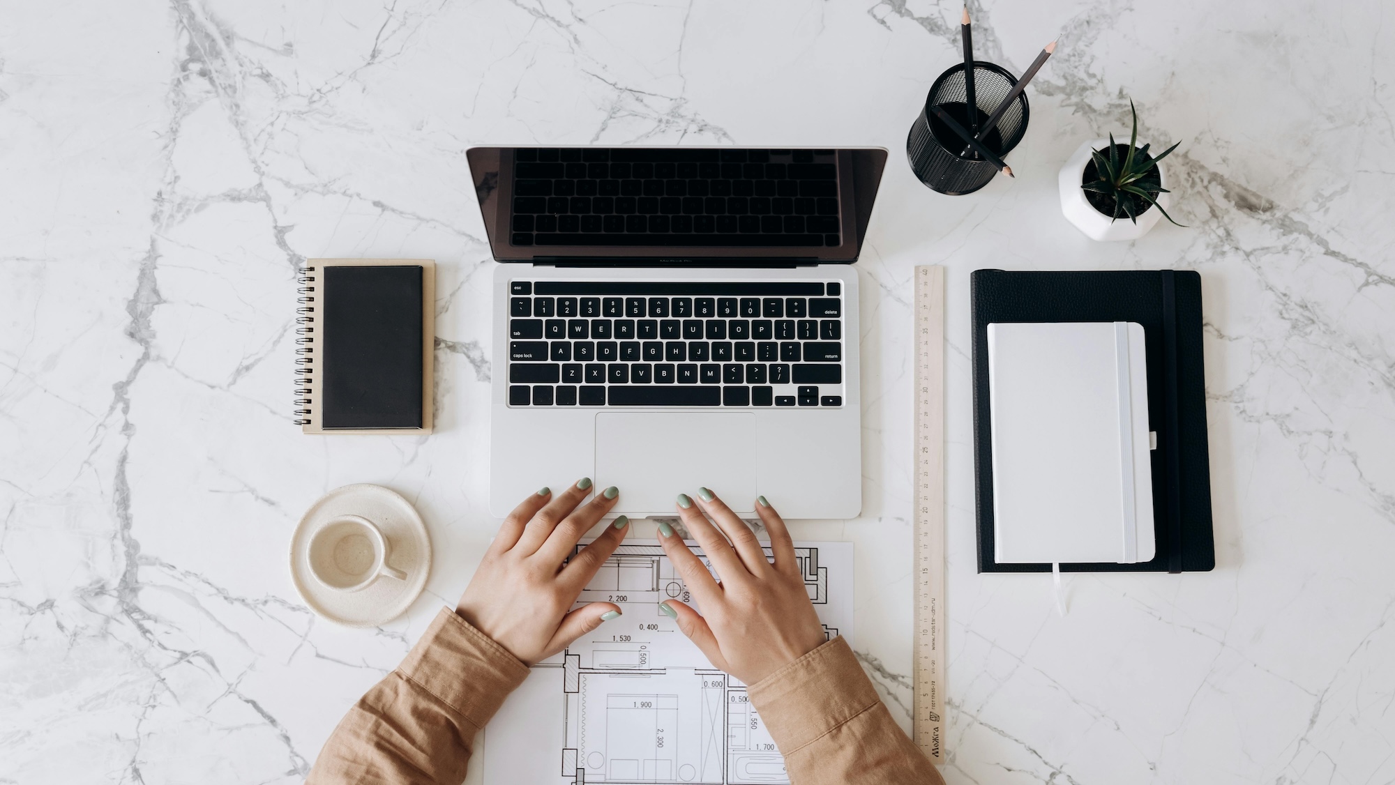 typing on a laptop learning How Blogging Helps You Get Found in AI Search Results