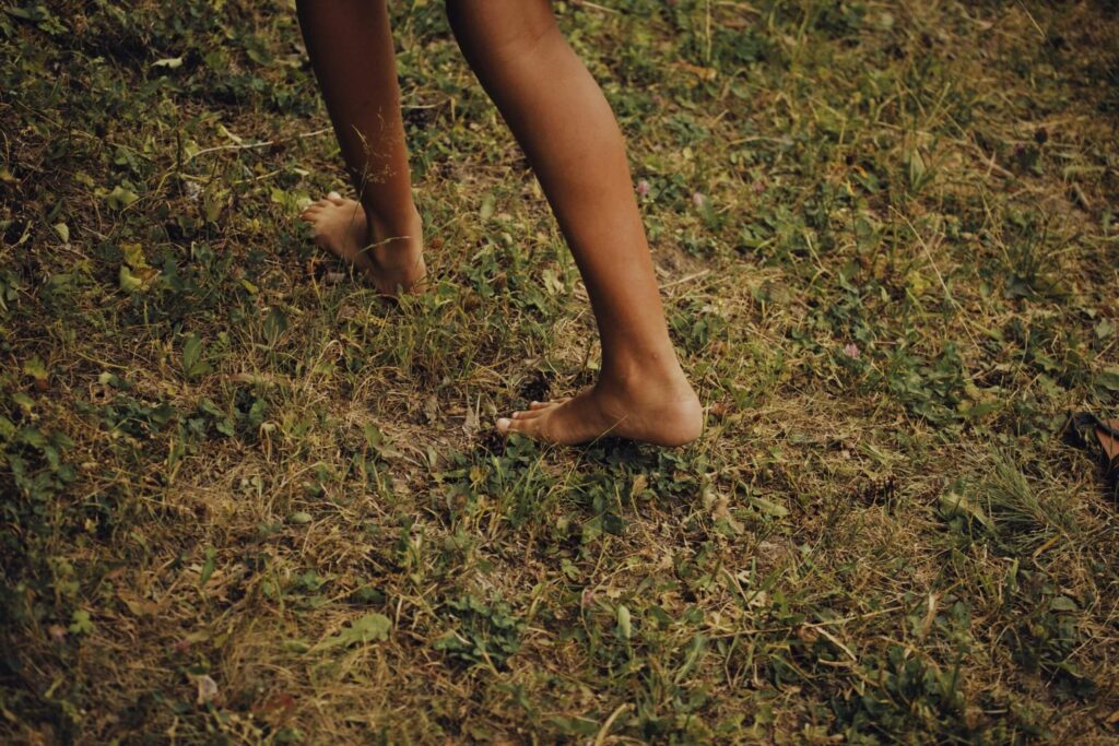 grounding technique of walking bare foot on the grass